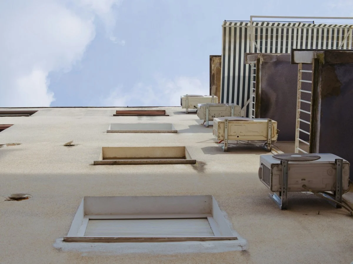 Multiple air conditioning units installed on a residential building in Tucson, Arizona