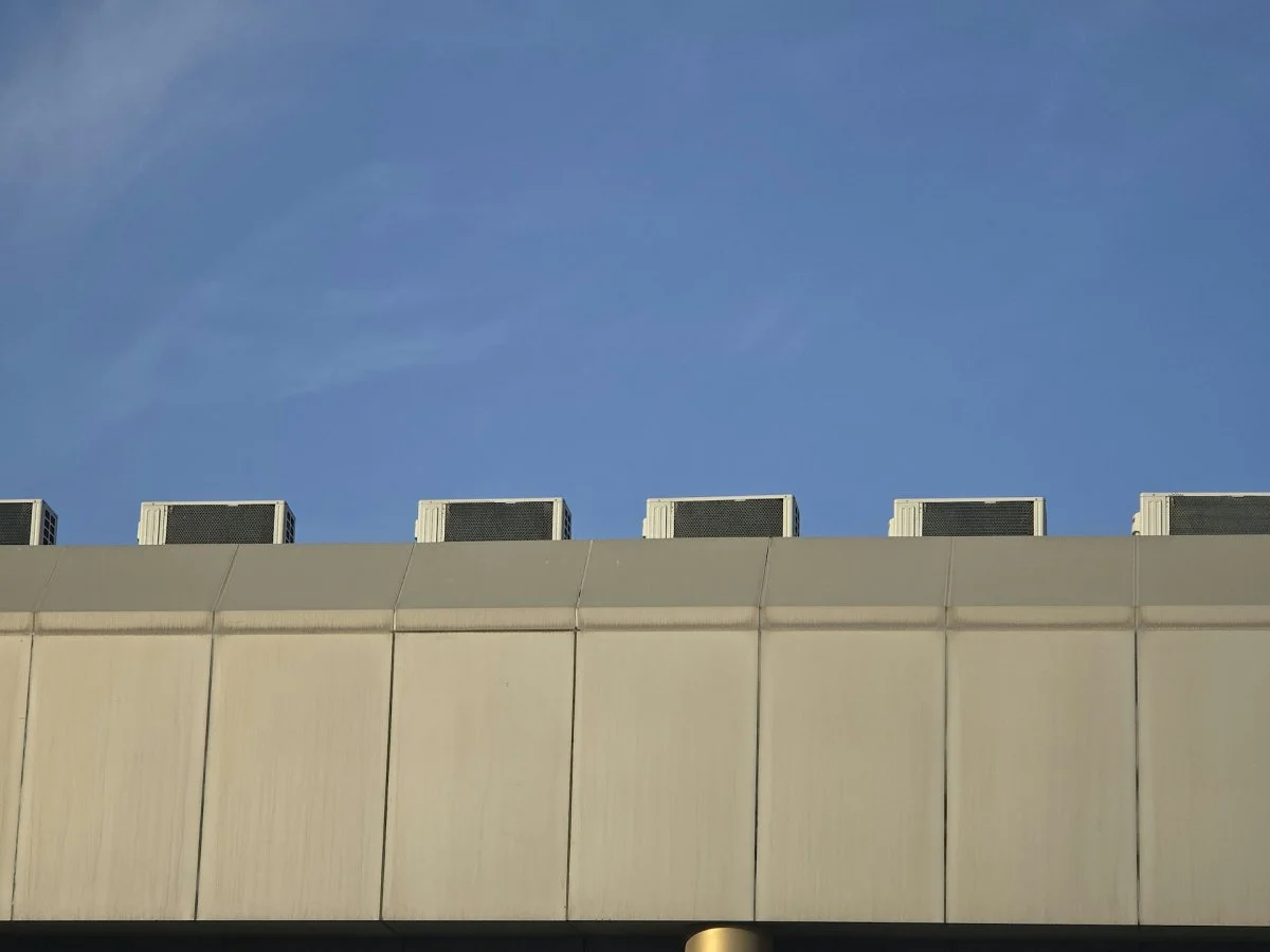 Multiple commercial HVAC units installed on a rooftop in Tucson, Arizona