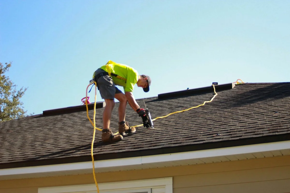Roofing contractor performing roof repair on a residential home in Tucson, Arizona