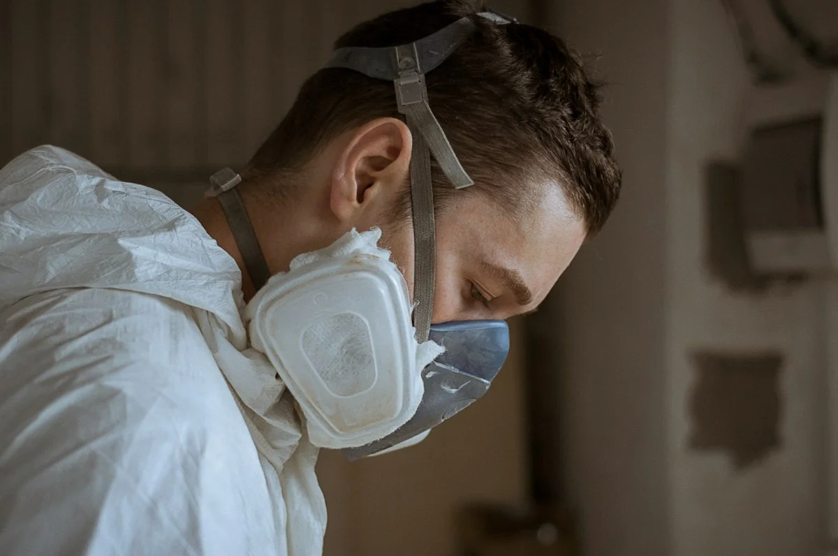Worker inspecting a room for mold issues in a residential property in Tucson, Arizona