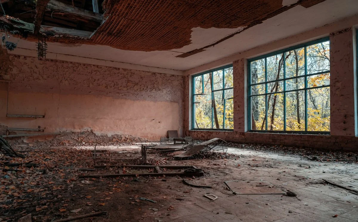 Fire-damaged interior room with visible burn marks and structural damage in Tucson, Arizona