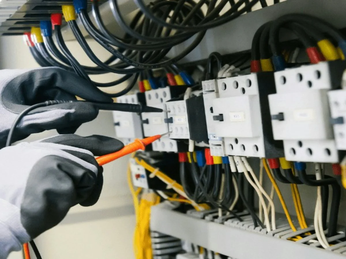 Electrician repairing an electrical panel in a residential property in Tucson, Arizona