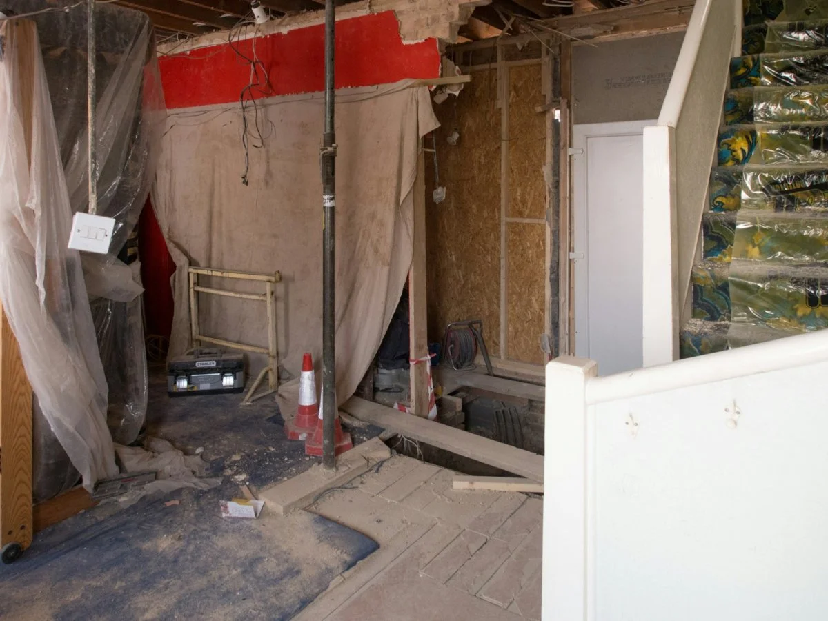 Water-damaged room with visible flooding and structural damage in Tucson, Arizona